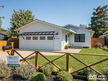 Updated home exterior in Novato featuring James Hardie Board and Batten Siding, new landscaping, and modern garage door