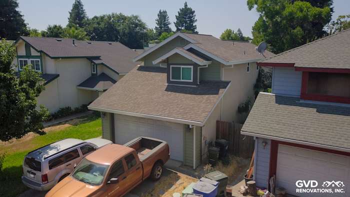 Home exterior featuring Prodigy Juniper Ridge siding, Milgard Trinsic windows, and contrasting white trim in Sacramento