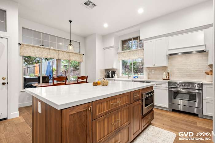 Modern kitchen remodel in Folsom featuring Waypoint cabinets, Fieldstone island, and Vadara Bronzo countertops