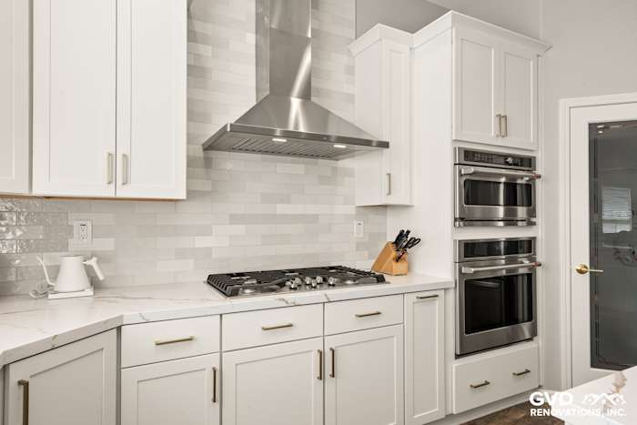 Modern kitchen with white Diamond cabinets, MSI countertops, and stylish backsplash in Roseville, CA