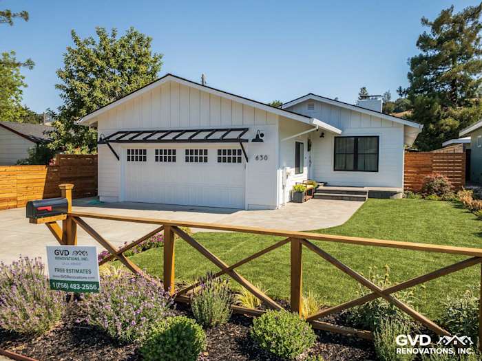Updated home exterior in Novato, featuring new James Hardie Board and Batten siding, garage, and landscaped yard