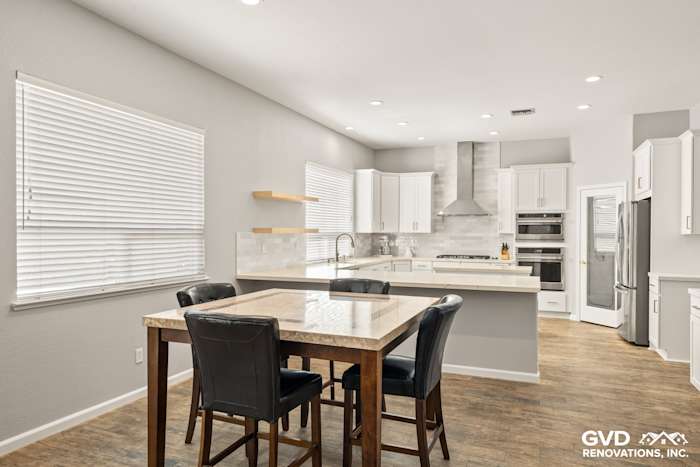 Bright, modern kitchen in Roseville with Diamond cabinets, MSI countertops, and floating shelves
