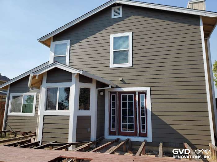 Newly installed James Hardie siding in warm gray on a unique Santa Rosa home, featuring stylish windows and entry