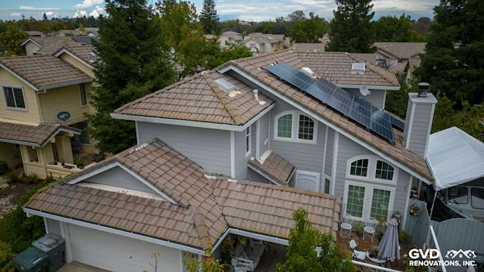 Home exterior featuring James Hardie Pearl Gray siding with Arctic White trim and a tile roof in Rocklin, CA