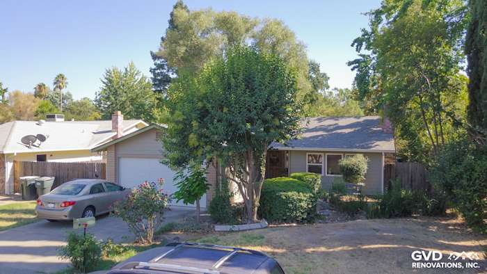 Front of a home featuring Monterey Taupe HardiePlank Lap Siding surrounded by greenery in Orangevale, CA