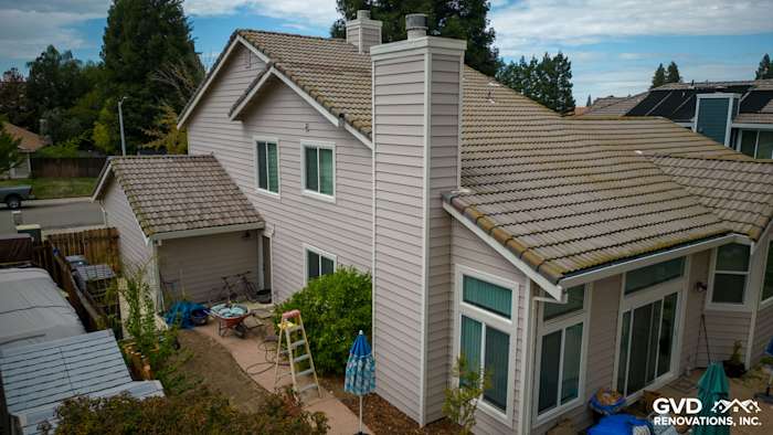 Roseville home's exterior featuring Craneboard Vinyl siding, updated windows, and a modern roofline