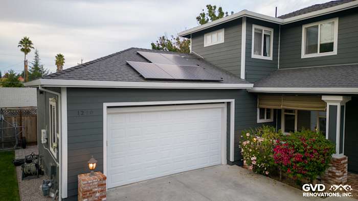Home exterior featuring Pearl Gray James Hardie siding, Arctic White trim, solar panels, and landscaping in Campbell, CA