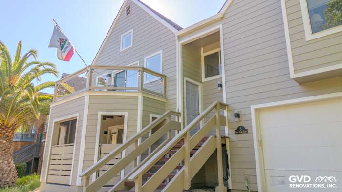 Home exterior featuring James Hardie lap plank siding in Monterey Taupe with white trim and a balcony in San Rafael, CA