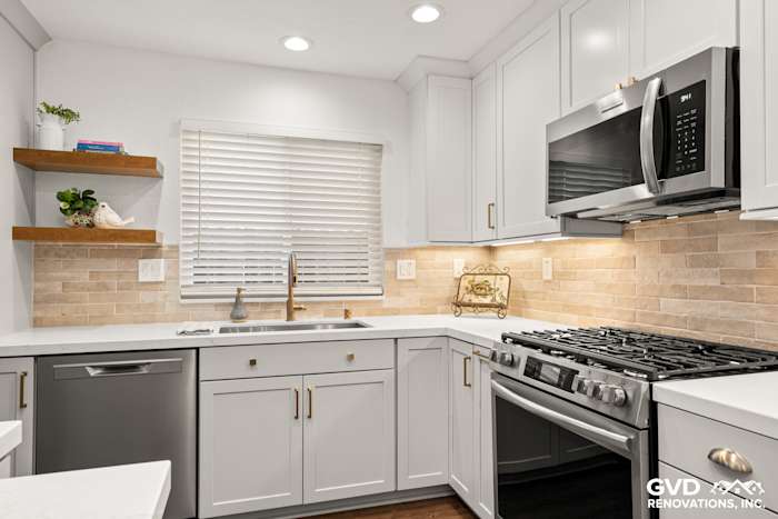 Modern kitchen in Roseville with Waypoint cabinetry, Vadara Naurelle countertops, and MSI Brickstone backsplash