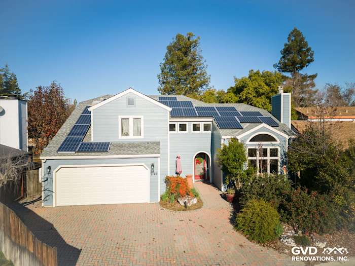 Home exterior featuring James Hardie Boothbay Blue siding, solar panels, landscaped front yard in Davis, CA