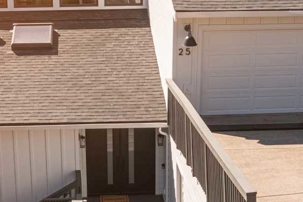 Newly installed Arctic White James Hardie lap and vertical siding on a modern home in Novato, CA