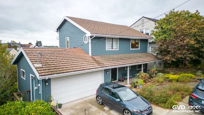 Oakland home featuring Evening Blue HardiePlank siding and Rustic Grain Arctic White trim with landscaped yard