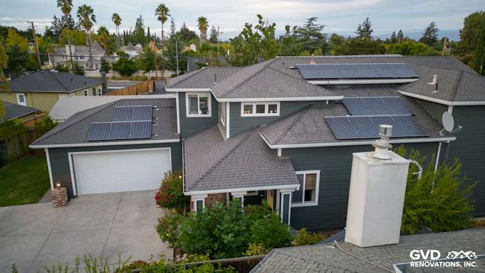 Campbell home with James Hardie Pearl Gray siding, Arctic White trim, and solar panels on the roof