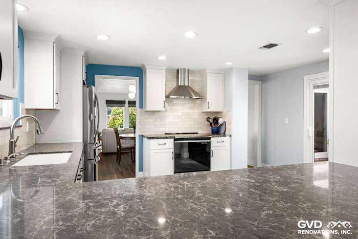 Modern Fair Oaks kitchen remodel featuring quartz countertop, stainless steel appliances, and stylish blue accents