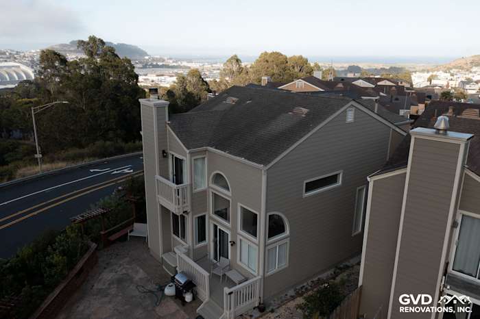 Daly City home featuring James Hardie Monterey Taupe siding and Cobble Stone trim, overlooking scenic views