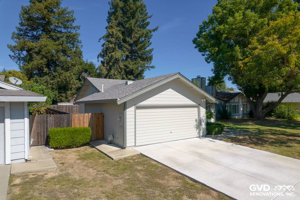 Modern home exterior featuring James Hardie Siding, Anlin Catalina Windows, and a clean driveway in Sacramento