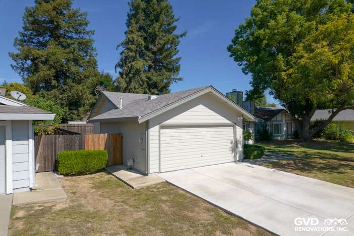 Modern home exterior featuring James Hardie Siding, Anlin Catalina Windows, and a clean driveway in Sacramento