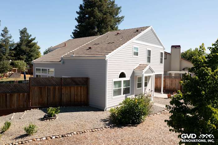Petaluma home featuring Pearl Gray James Hardie siding, Arctic White trim, and landscaped yard