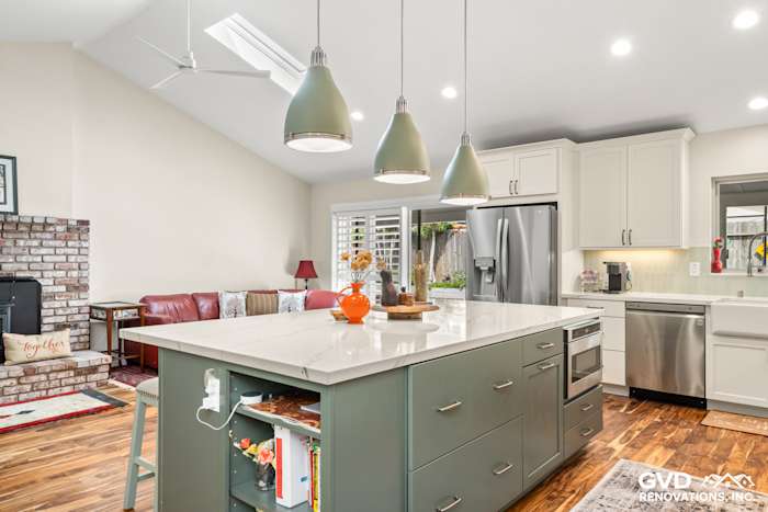 Modern kitchen remodel in Carmichael featuring custom island cabinets, quartz countertop, and stylish pendant lighting