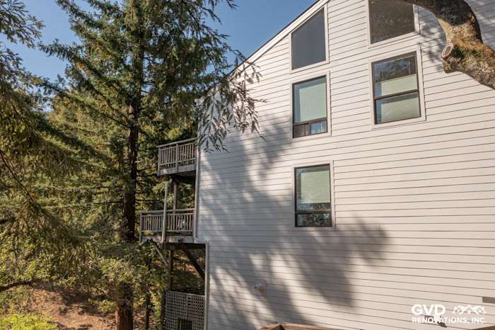 Arctic White James Hardie siding on a two-story home in Novato, showcasing lap and vertical designs