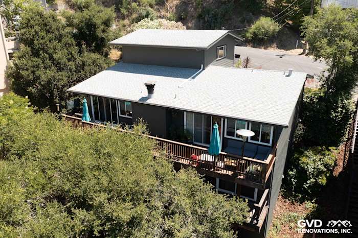 Oakland home exterior featuring James Hardie Iron Gray lap siding and a spacious upper deck