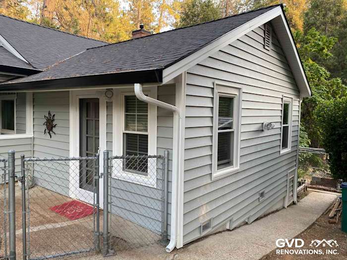Light gray Prodigy vinyl siding and a new roof enhance this Grass Valley home's exterior