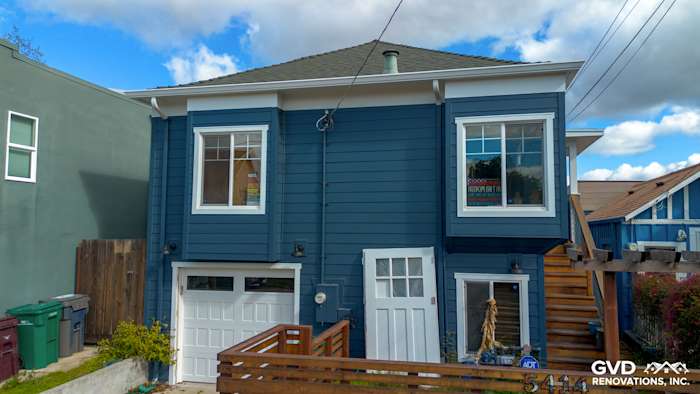 Home exterior featuring James Hardie Evening Blue siding and Arctic White trim in Oakland, CA