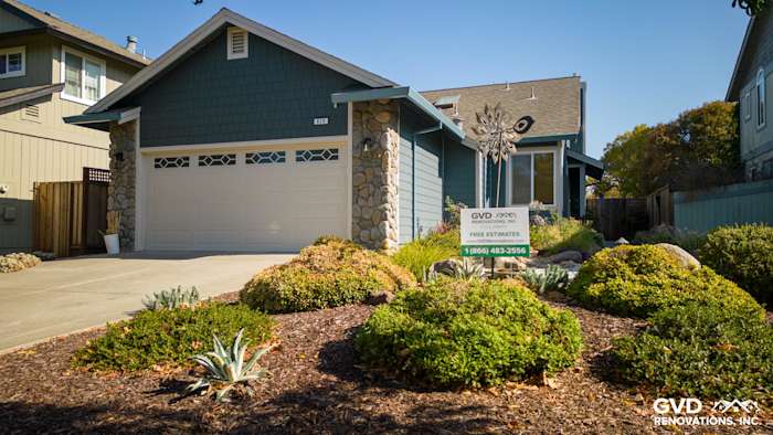 Evening Blue James Hardie lap siding and Cobble Stone trim on a Petaluma home exterior with landscaped yard