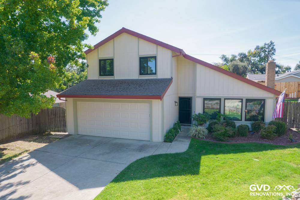 Home exterior transformation showcasing T1-11 siding, Anlin windows, and a landscaped yard in Orangevale