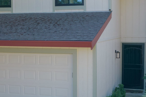 Home exterior transformation showcasing T1-11 siding, Anlin windows, and a landscaped yard in Orangevale