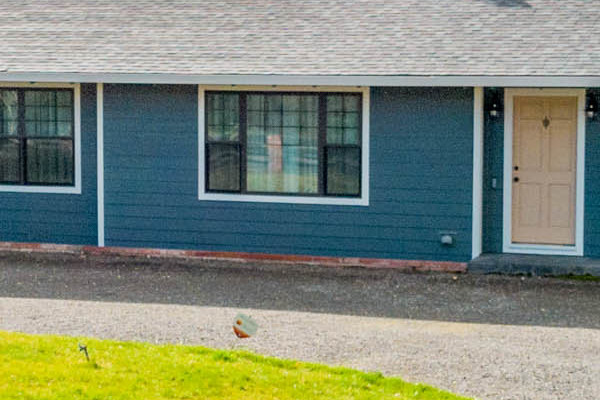 Sonoma home with new James Hardie siding in Evening Blue and Arctic White trim, showcasing a modern facade