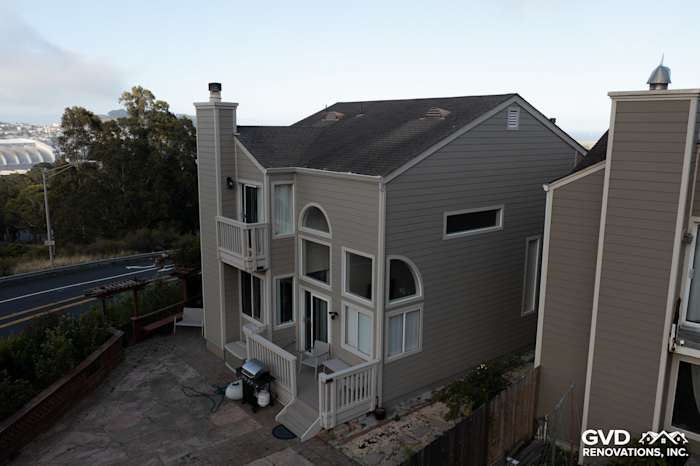 Daly City home featuring James Hardie lap siding in Monterey Taupe and Cobble Stone trim. Renovated exterior view