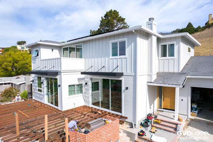 Artisan Lap Siding installation on a modern home exterior in Tiburon, showcasing fresh white paint and large windows