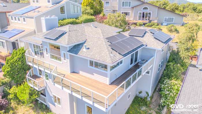 Modern home exterior featuring James Hardie Pearl Gray siding, Arctic White trim, and solar panels in Mill Valley