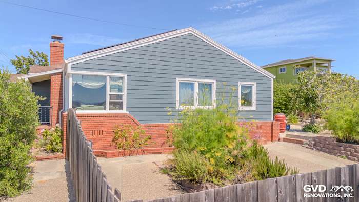 Home exterior featuring James Hardie Lap Siding in Evening Blue with Arctic White trim in Richmond, CA