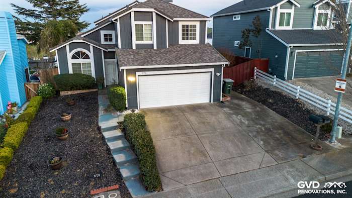 Two-story home in Vallejo with James Hardie Evening Blue siding, Arctic White trim, and well-maintained landscaping