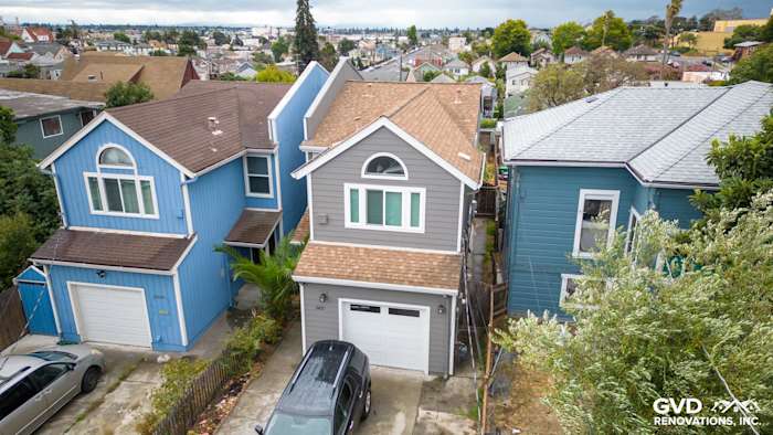 Aerial view of a renovated home featuring Aged Pewter James Hardie siding and Arctic White HardieTrim in Oakland