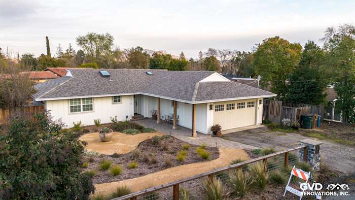 Modern home exterior in Pleasant Hill featuring James HardiePanel Vertical Siding in Arctic White with landscaped yard