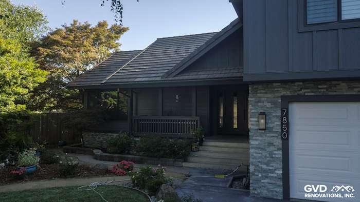 Sleek home exterior featuring Night Gray HardiePlank siding and modern stone accents in Sacramento