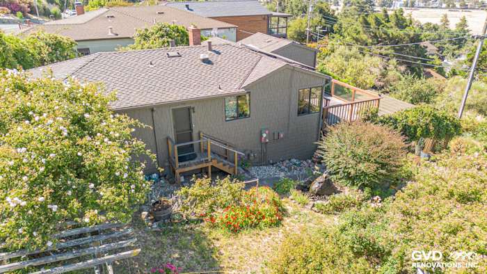 Home exterior in Vallejo featuring James Hardie Shake & Shingle Siding, surrounded by landscaped garden and stairs