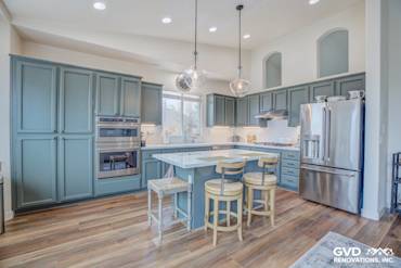 Modern kitchen remodel in El Dorado Hills with blue cabinets, quartz island, and stainless steel appliances
