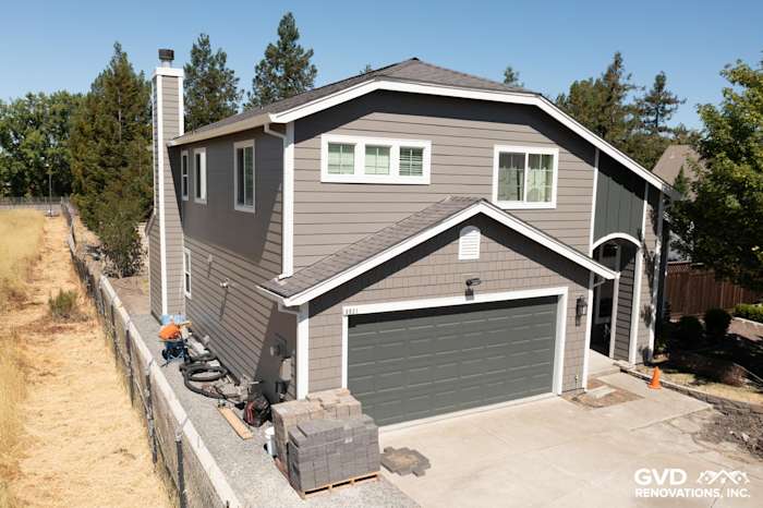 Rohnert Park home exterior featuring James Hardie Aged Pewter siding and Arctic White trim, showcasing a charming renovation