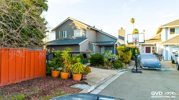 Hayward home exterior featuring modern Ageless Slate Alside Prodigy vinyl siding and vibrant landscaping