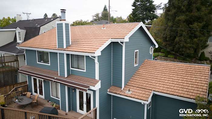 Evening Blue HardiePlank siding and Rustic Grain Arctic White trim on a remodeled Oakland home exterior