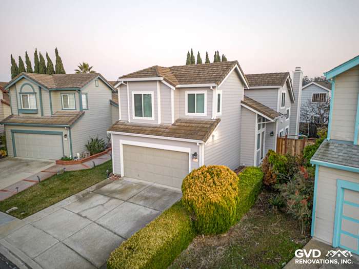 Fremont home showcasing updated James Hardie Pearl Gray siding and Anlin windows with landscaped front yard