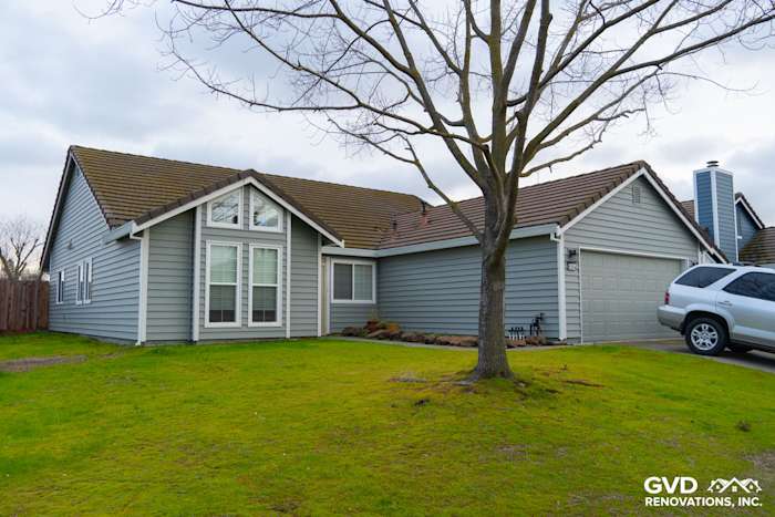 New Prodigy Solid Core Insulated Siding on a home exterior, featuring painted eaves and gutters in Sacramento