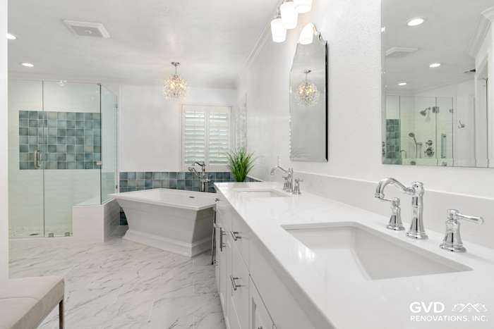 Bright bathroom remodel featuring quartz countertops, a freestanding tub, and modern tiles in Fair Oaks
