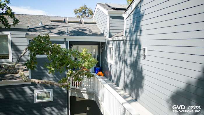 Orinda home exterior featuring James Hardie Night Gray siding and Arctic White trim on a sunny day