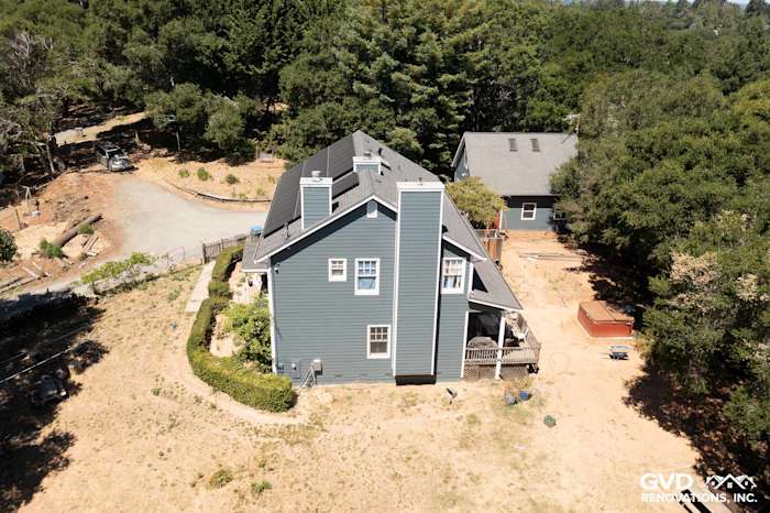 Home exterior with Evening Blue James Hardie lap siding and Arctic White trim in Sebastopol, CA