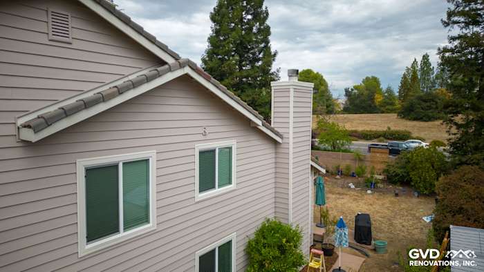 Home exterior showcasing newly installed Craneboard Vinyl siding and windows in a Roseville property